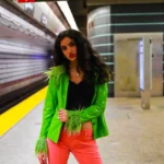 Adeline V. Lopez in a green jacket and pink pants