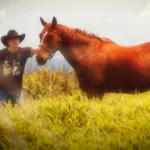 Billy Ray Norris standing next to a horse