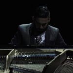 Justin Ryan Ruiz playing piano on "Little Cabin Boy" album