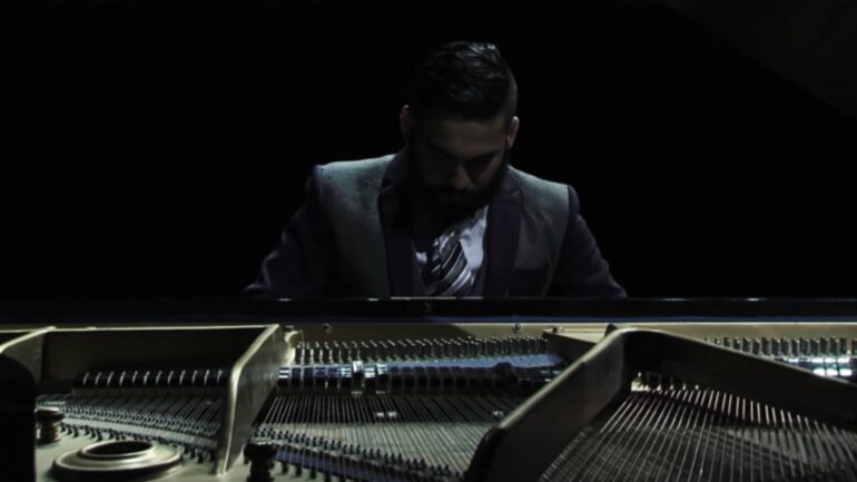 Justin Ryan Ruiz playing piano on "Little Cabin Boy" album