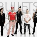 Rock band Bullets And Octane posing against a white background with their band name in large letters.