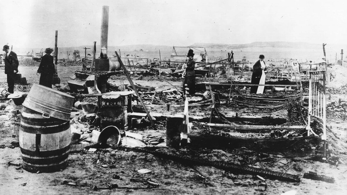 Ruins of the Ludlow tent colony after the Ludlow Massacre of 1914, showing debris and survivors.