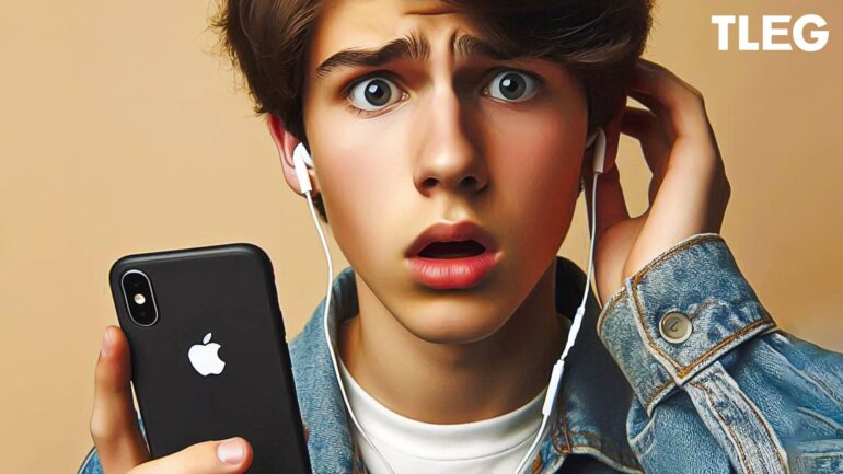 A surprised young man wearing earphones and holding an Apple iPhone, illustrating a reaction to the superior audio quality of Apple Music compared to Spotify.