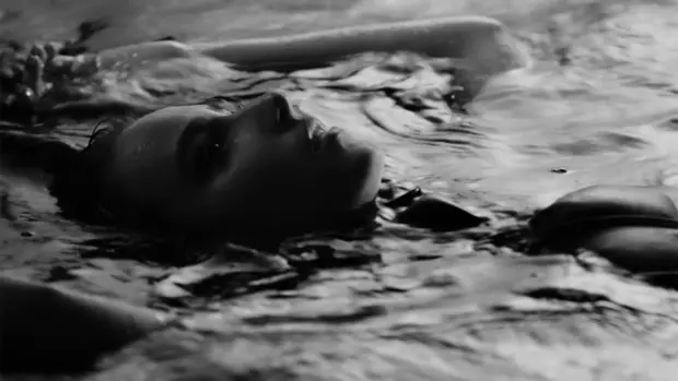 Black-and-white album cover featuring Bruklin submerged in water with a reflective and emotional expression.